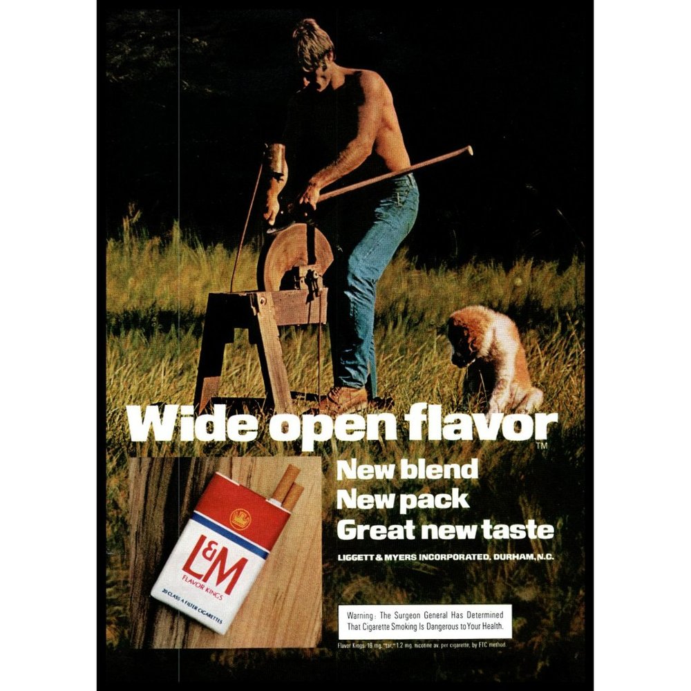 1974 L&M Cigarette Wide Open Flavor Vintage Print Ad Axe Grindstone Dog Wall Art